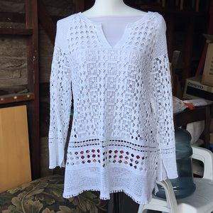Crocheted lace, hip-length long sleeved blouse.